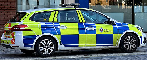 Kent Police Peugeot 308 estate patrol car outside Pentagon Shopping Centre, Military Road, Chatham, Kent, England, 29 September 2025