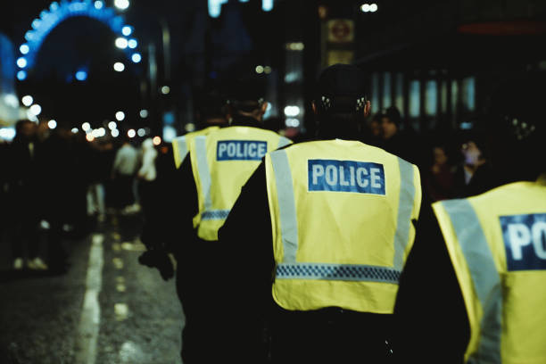 Victoria Street, London UK 31st December 2022 (01st January 2023) New Year´s Day in London New Year's Eve on Victoria Street at Westminster Abbey, an Anglican church. British Police, New Year's Day in London: New Year's Eve celebrations, Victoria Street, Westminster Abbey, London Eye, City Of Westminster, Central London England, Britain, UK, Night, Street