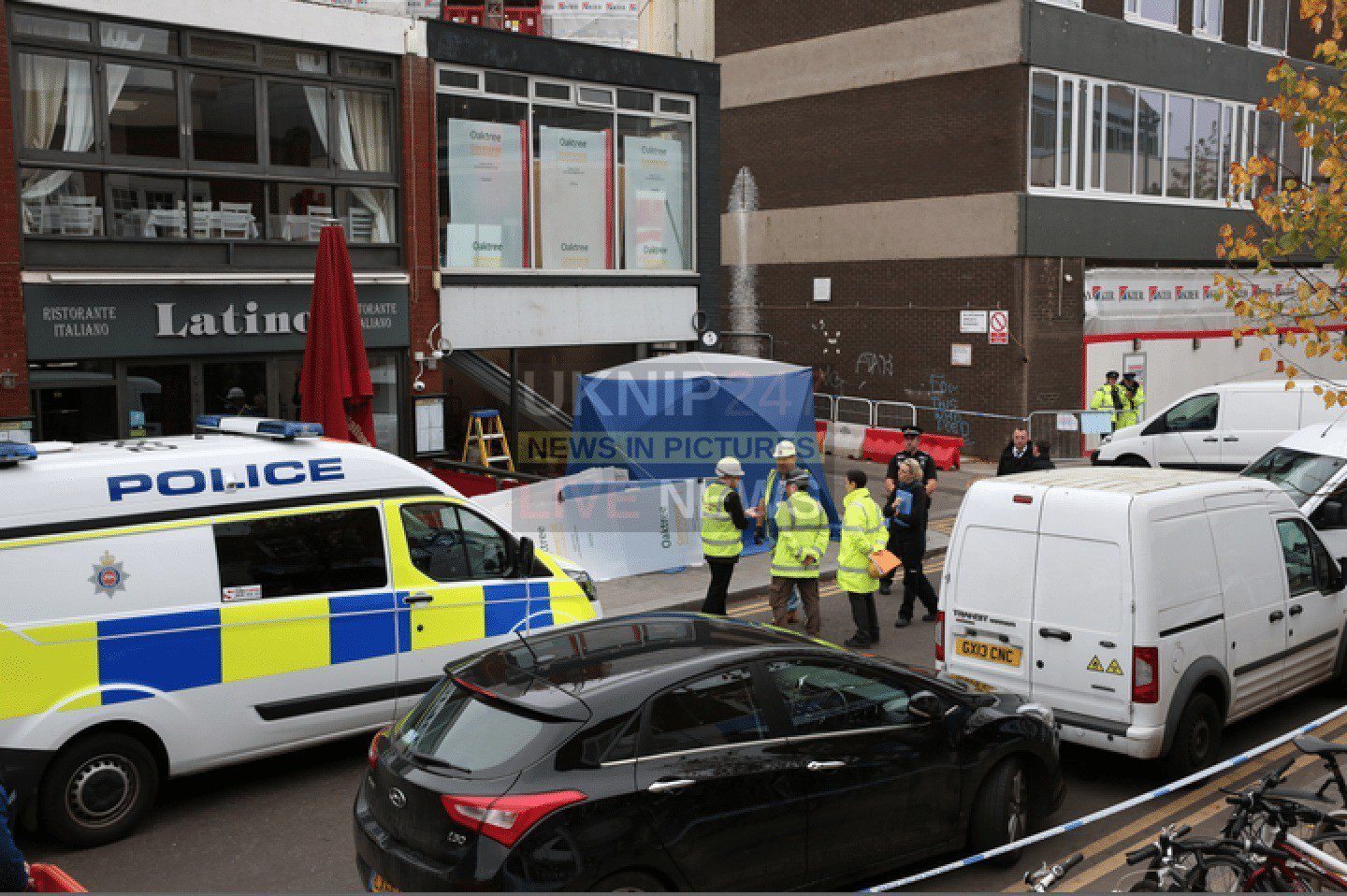 Man crushed to death by shop roller shutter in Woking