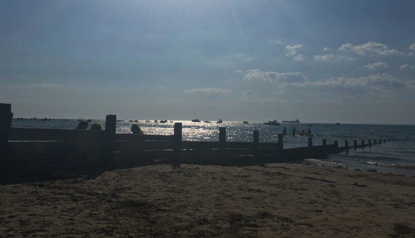 Wet Suit Wearing woman pulled from Isle of Wight Beach left fighting for her life