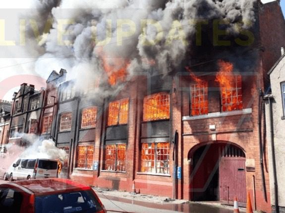 Firefighters Continuing To Deal With  Blaze That Ripped Through  Kettering Business