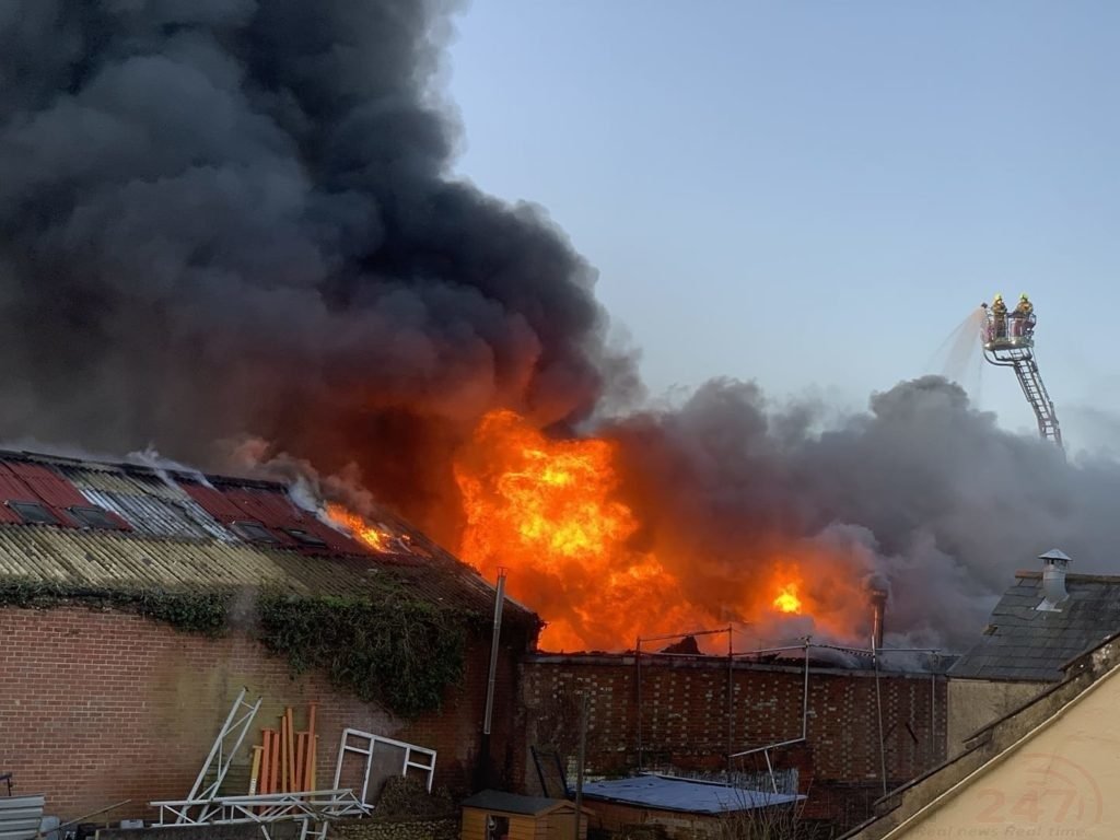 Fire crews from Three Counties tackle workshop engulfed in flames