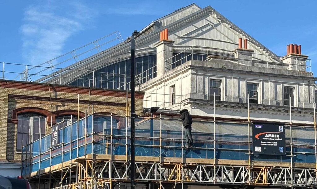 Emergency Services Swarm Brighton railway station After Man Climbs Scaffolding