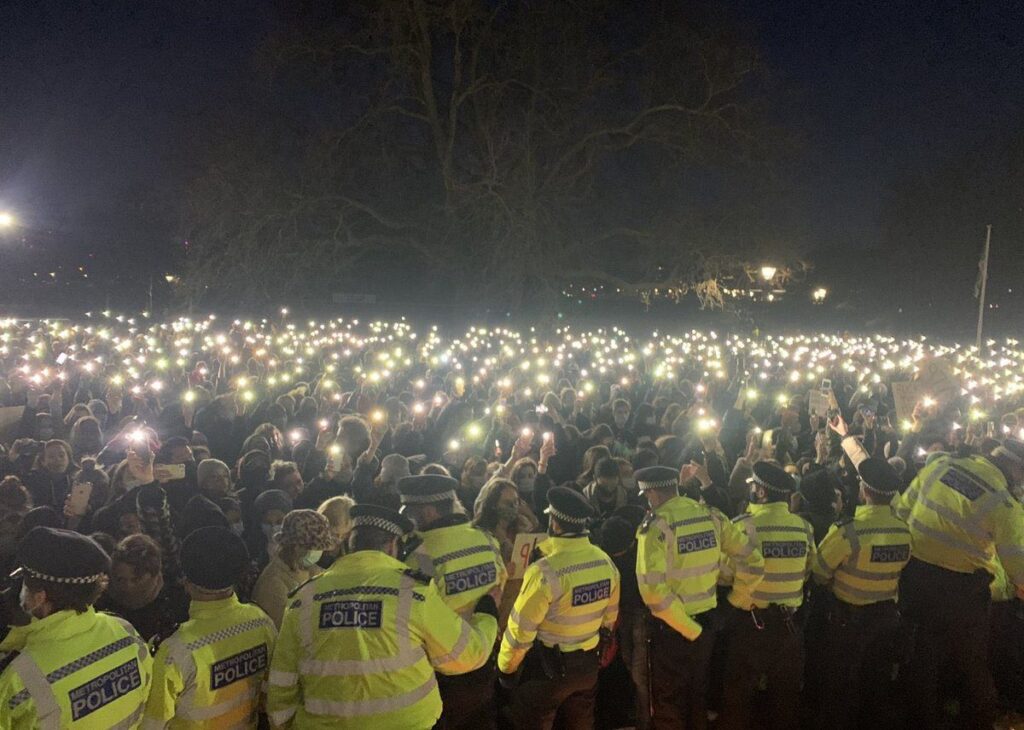 Confrontations have broken out between police and members of the public attending a vigil for Sarah Everard