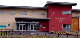 A man who was found carrying drugs into a Peterborough prison has been jailed