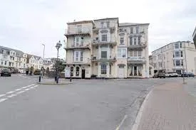 Woman Punched and Dog Kicked in Ilfracombe Assault – Police Hunt Two Men with Scar and Grey Hair
