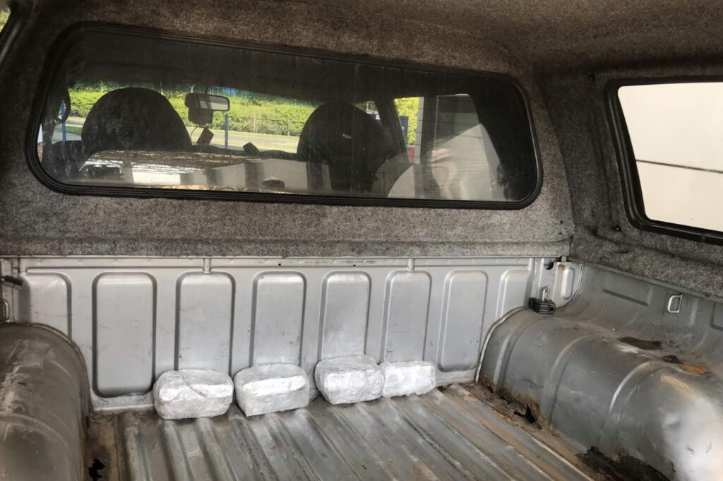 Border policing officers from Kent Police have arrested a man after £50,000 cash was found hidden beneath the lining of his pickup truck