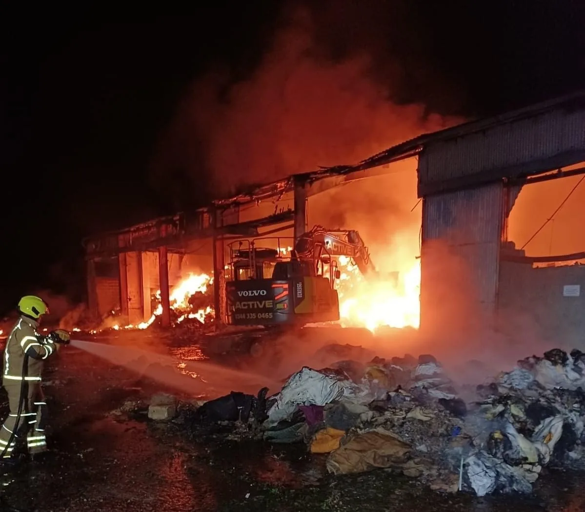Firefighters Battle Persistent Blaze at Broad Road Industrial Unit – Residents Urged to Stay Safe and Keep Windows Shut