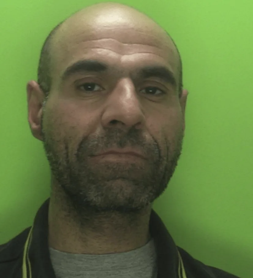 A man who danced around a busy city centre square before suddenly attacking someone with an axe has been jailed
