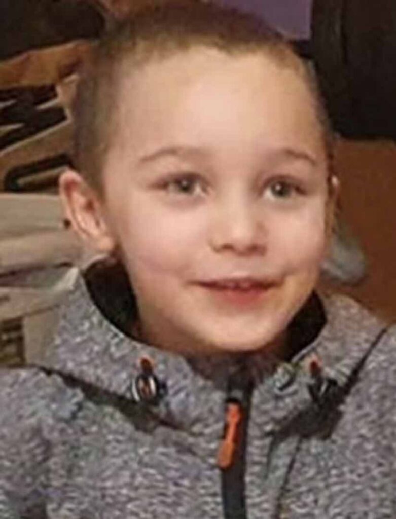 A man accused of murdering a five-year-old boy has told a court he and the boy’s mother panicked and put his body into a sports bag after he died in bed