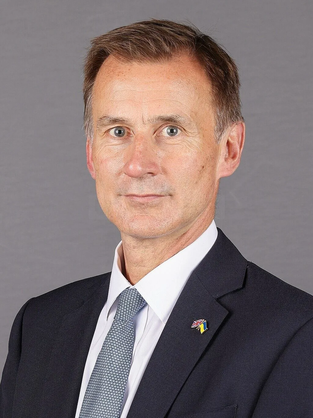 Sunak Concedes Defeat as Hunt Narrowly Retains Seat
