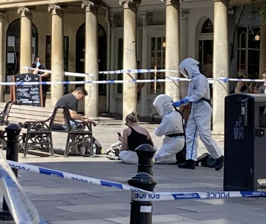Chemical Chaos in Bath: Woman Exposes Pedestrians to Mystery Powder on Stall Street