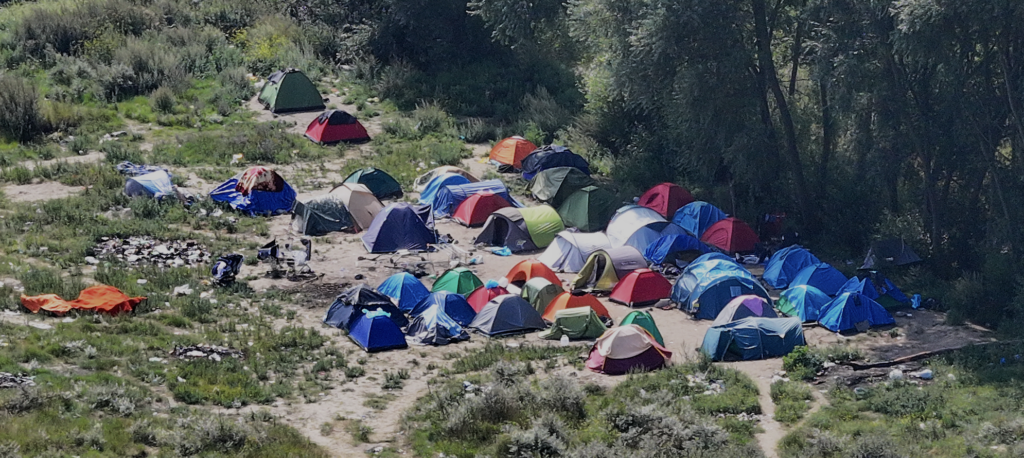 Calais Migrant Camp Raided After Deadly Channel Tragedy Claims 12 Lives