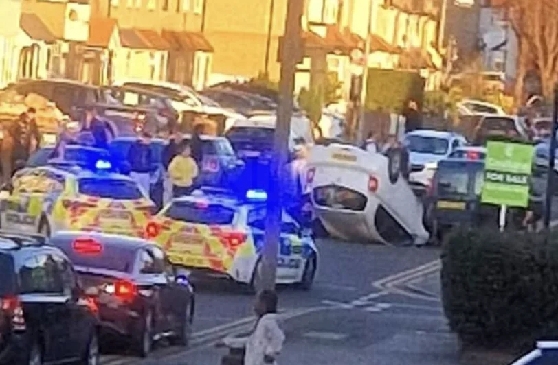 Crash Chaos in Chingford: Car Overturns on Hall Lane, Driver Trapped – Emergency Services Rush to Scene