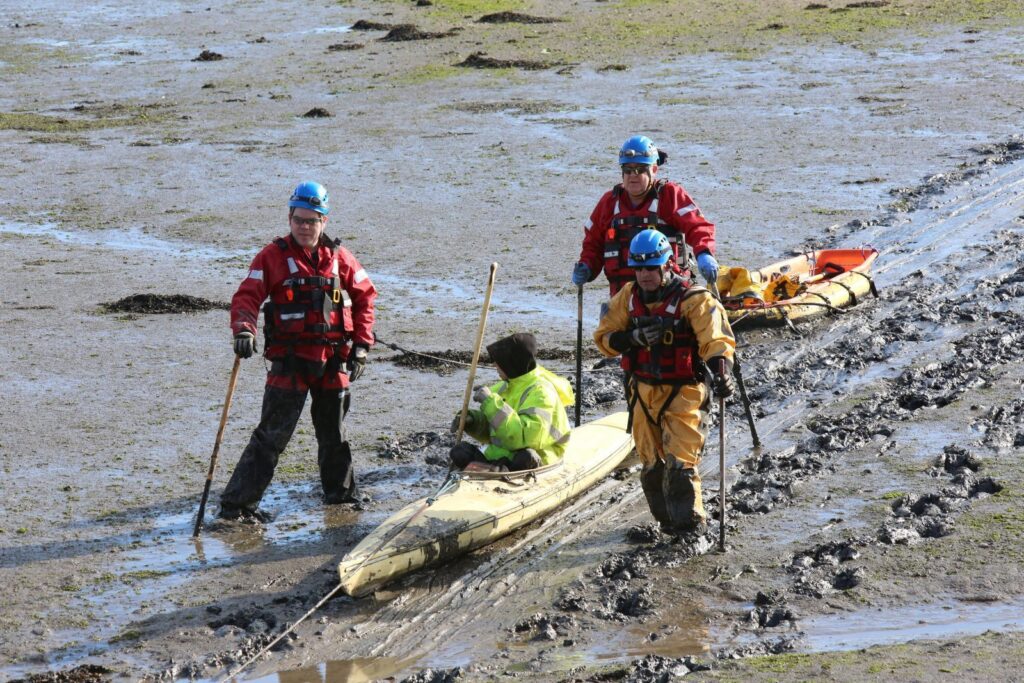 Rescue Operation to Pull Man from a Canoe Stuck in the Mud