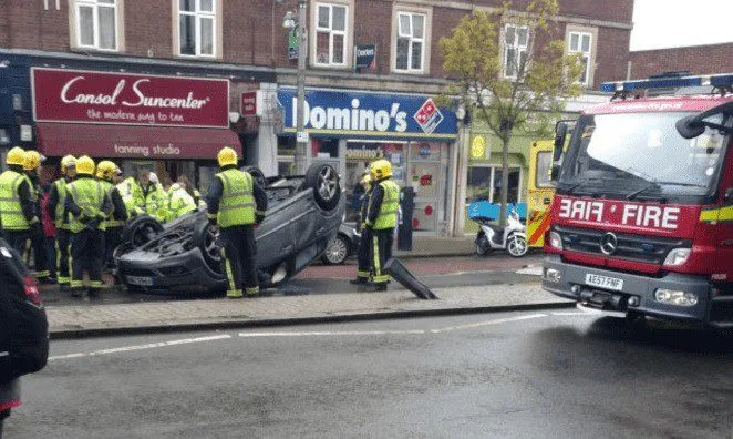 Twickenham Chaos: Fire Crews Race to Free Driver from Flipped Vauxhall Astra on Heath Road