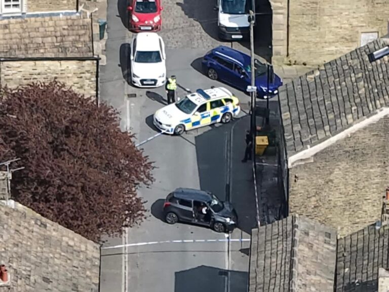 Man in 70s Hospitalised After Suzuki Hits Building in Bradford