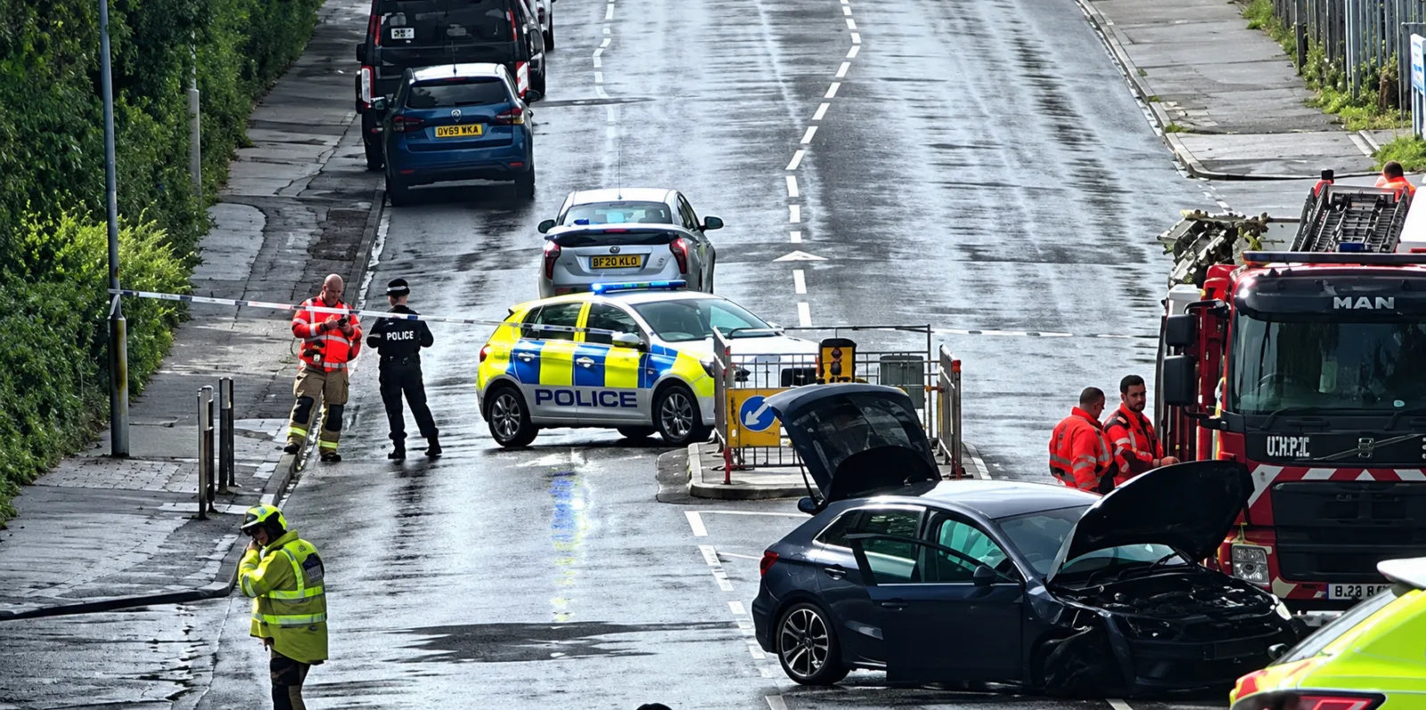 Two police officers and driver taken to hospital after emergency response crash in Moston