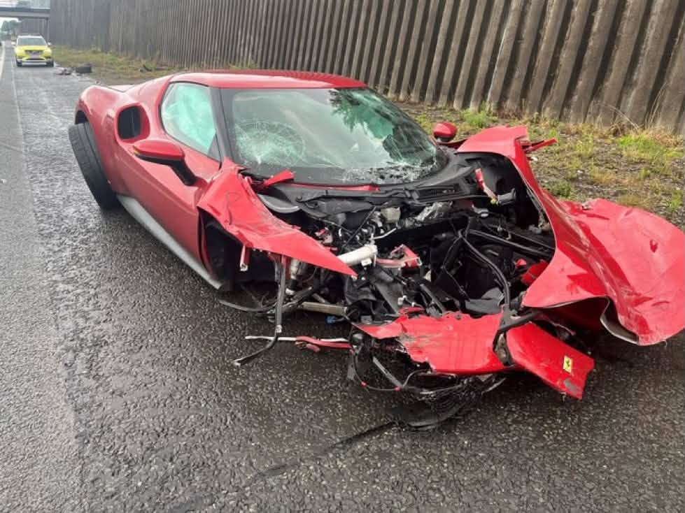 Ferrari 296 destroyed after driver loses control in wet on M602