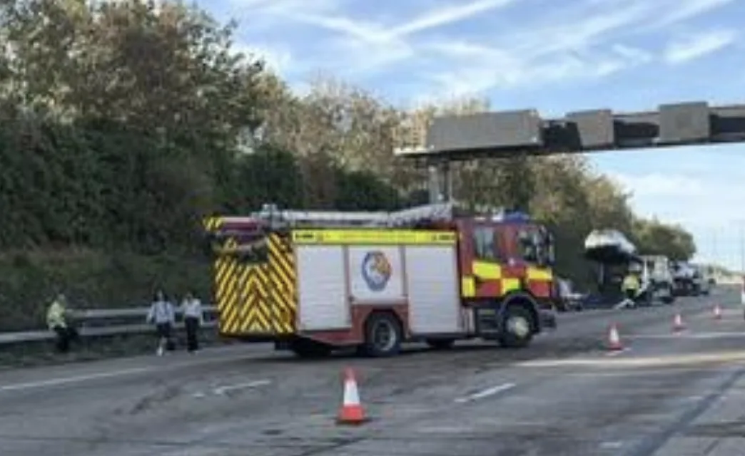 Fire engine and emergency crews attending a collision on the M25