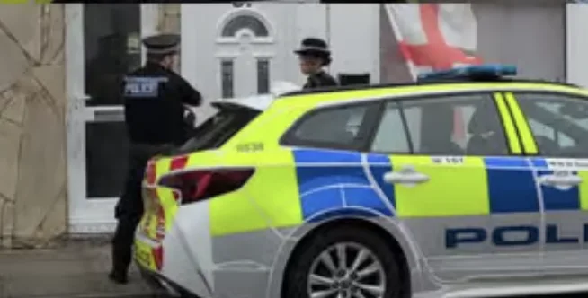 Crime scene investigators enter Portsmouth home as police cordon off street