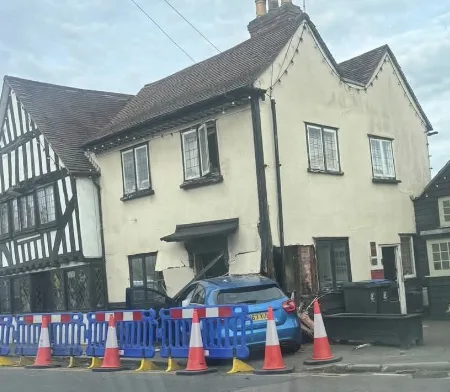 Car crashes into front of house at busy Abridge junction