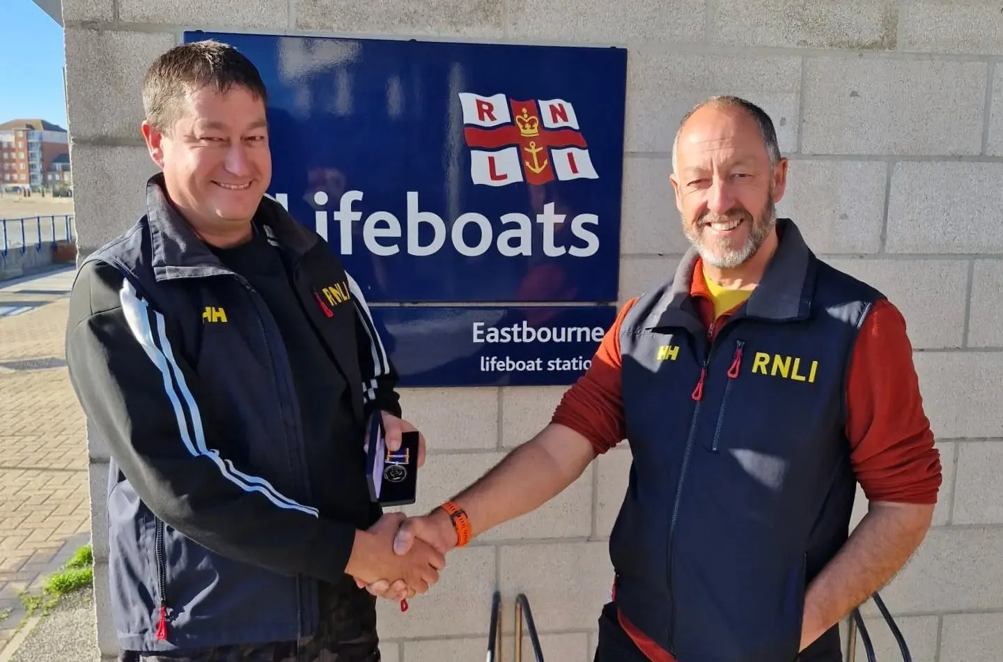 Eastbourne RNLI helmsman honoured for 30 years of lifesaving service