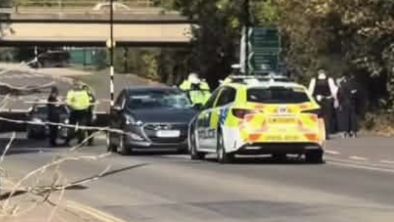 Police cordon Kensington Road in Northolt after collision involving car and electric bikes