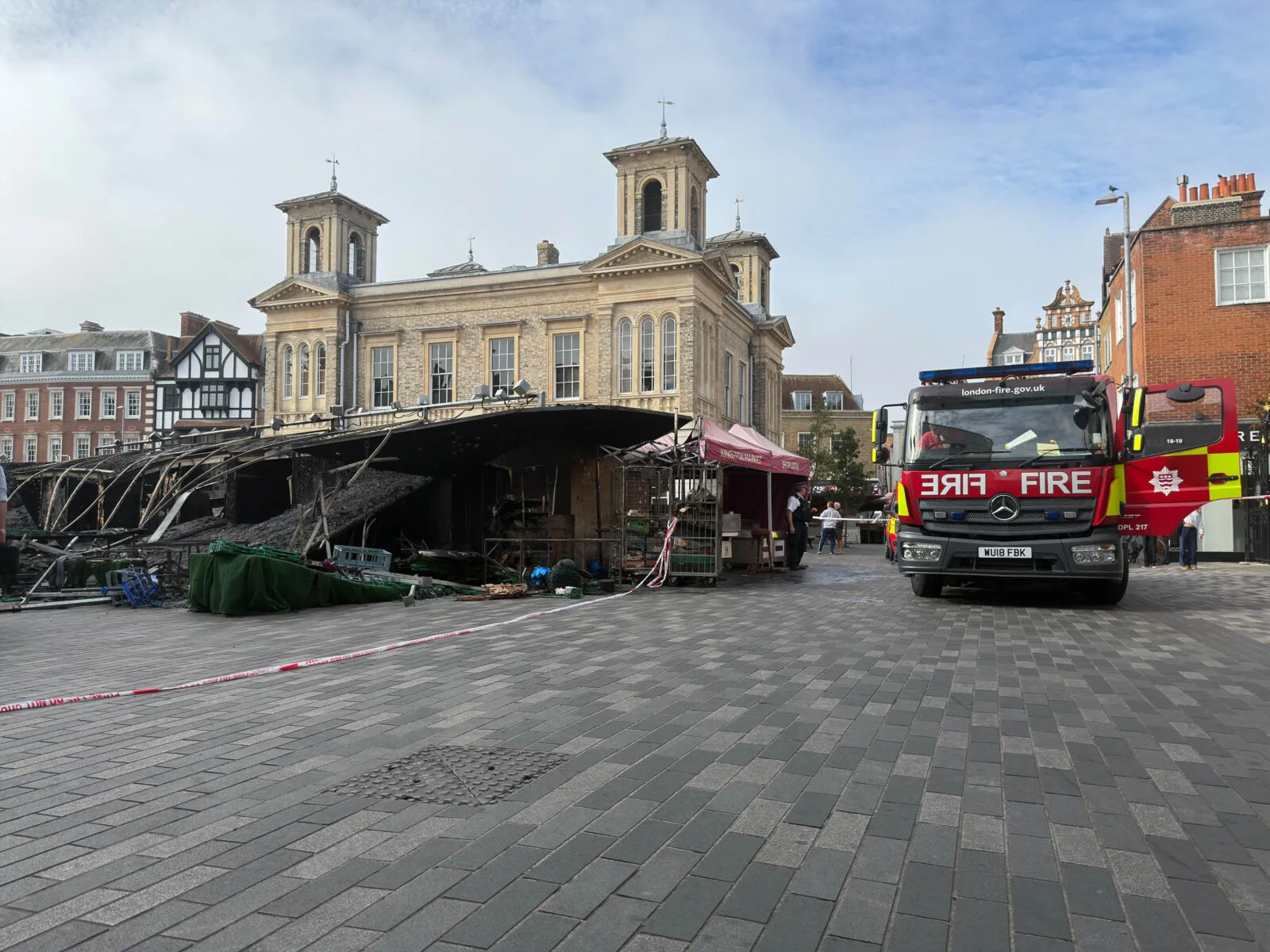 Eight people evacuated as fire tears through historic Kingston market