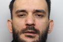 A man found hiding in the loft of a suspected cannabis factory has been jailed