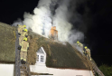 Crews Battle Overnight Thatch Roof Fire in Rayne