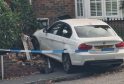 Driver Flees Scene After BMW Crashes Into House in Crawley