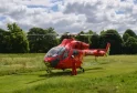 London, UK - May 28 2022:  London's Air Ambulance helicopter lands in a park.
