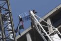A 69-year-old Protester Has Mounted A Crane At A Nine Elms Building Site And Unfurled A Palestinian Flag As Police Try To Talk Him Down