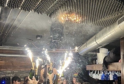 Waitress Holds Sparkler Moments Before Deadly Swiss Nightclub Blaze Kills 47